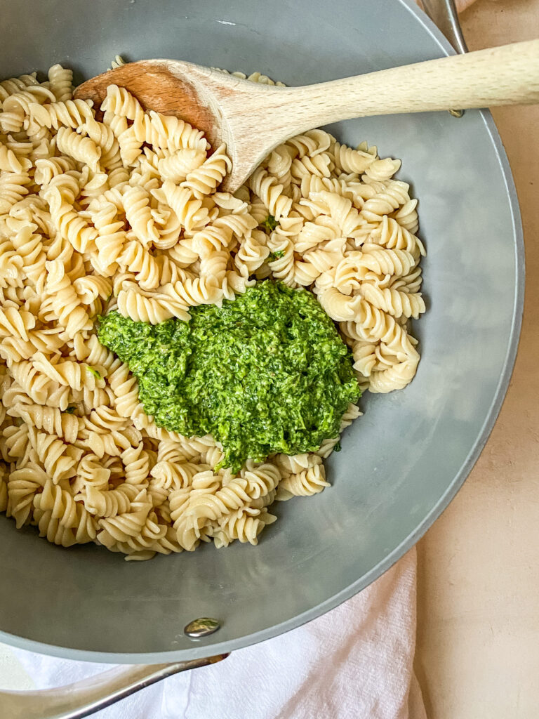 Above view of kale pesto in a post with pasta