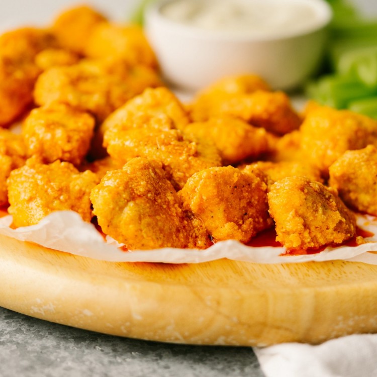 Side view of buffalo chicken bites on a serving platter