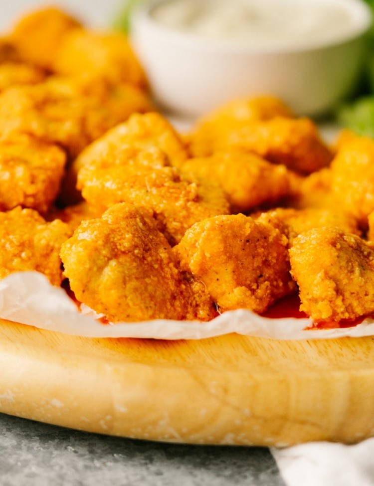 Side view of buffalo chicken bites on a serving platter