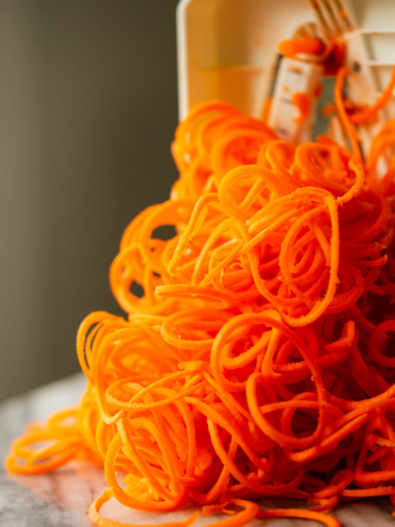 Side view of carrot noodles made with a spiralizer