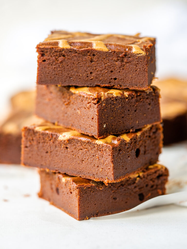 Side view of a stack of flourless sweet potato brownies