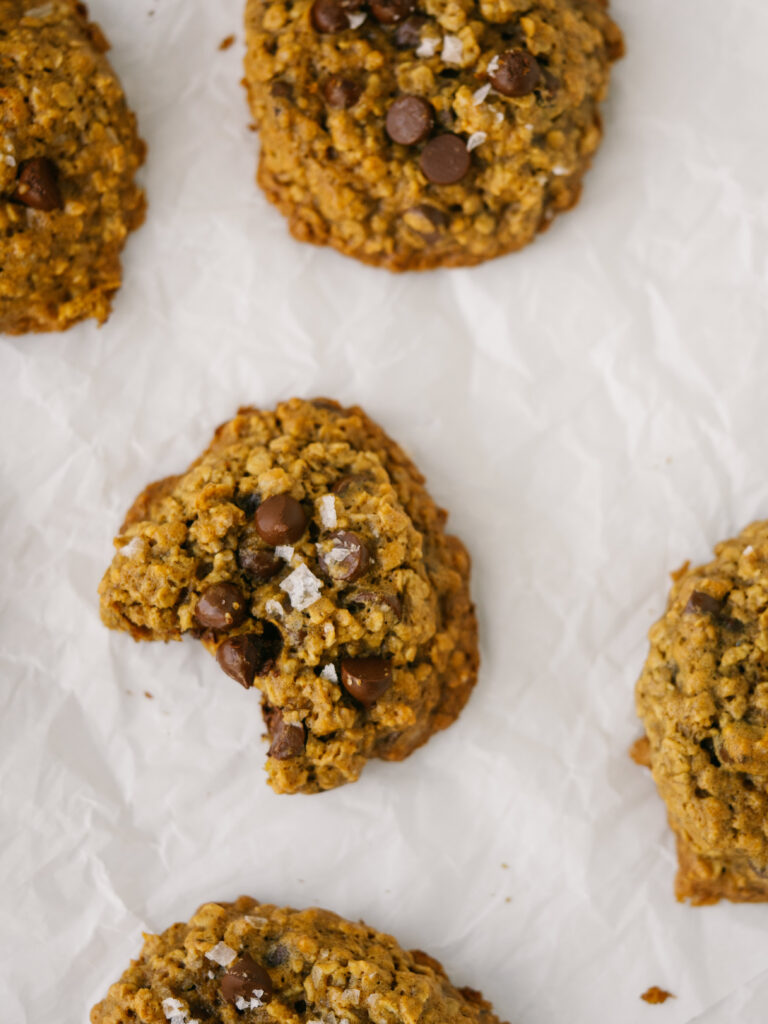 Above view of chocolate peanut butter oatmeal cookies of a parchment paper