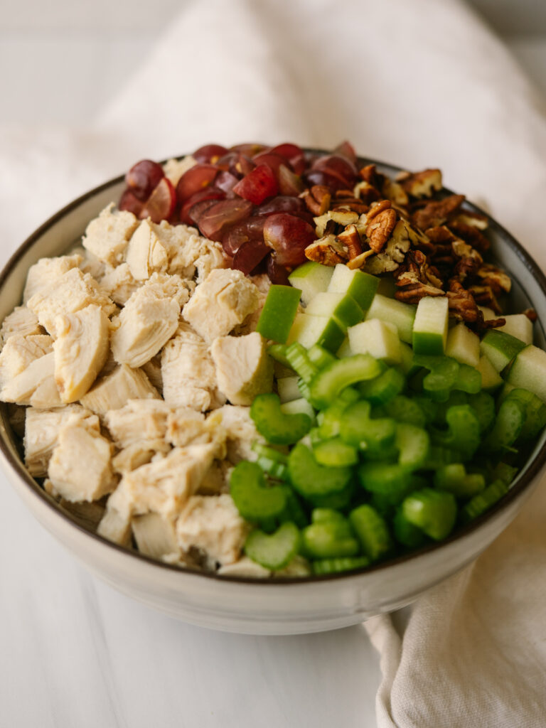 Three quarter view of ingredients for a healthy waldorf salad