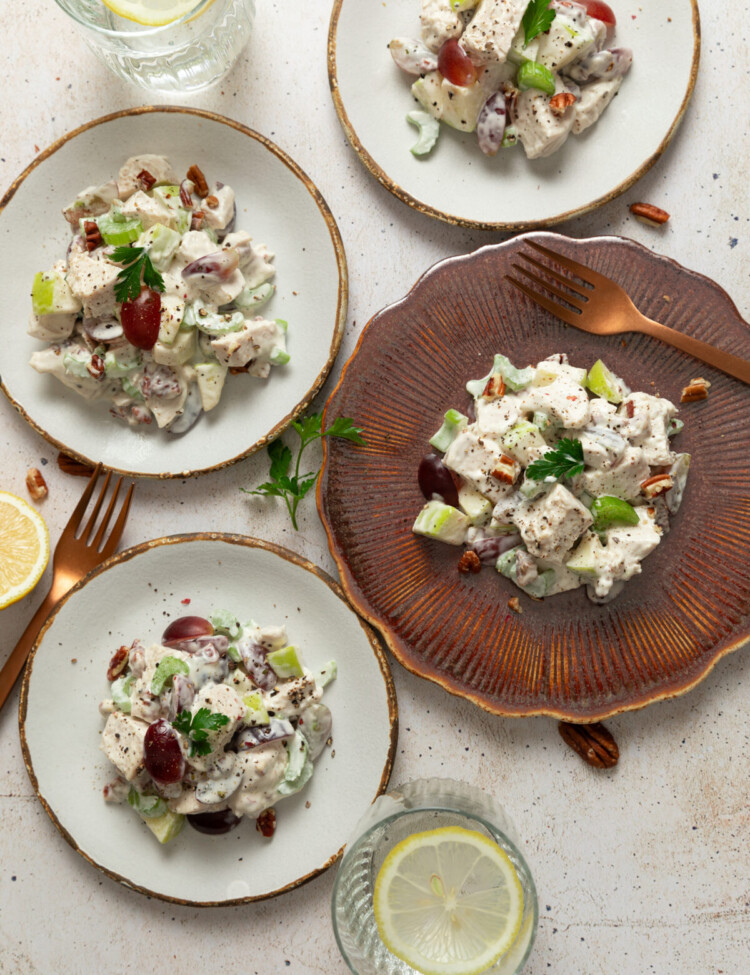 an above view image of waldorf chicken salad servings on four plates