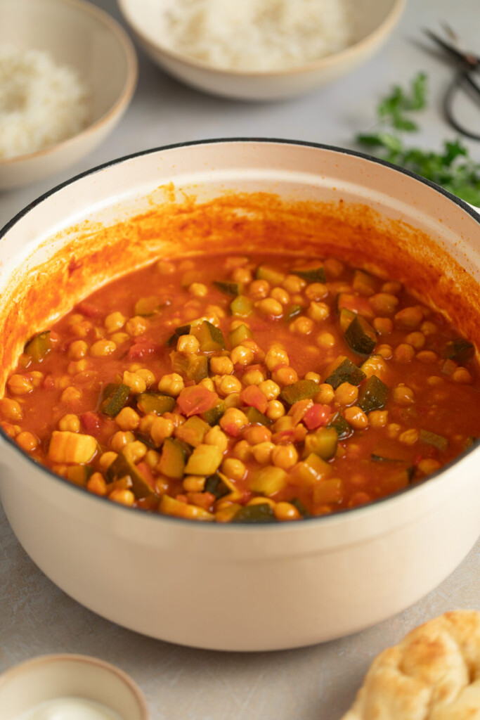 a three quarter view photo of chickpea stew in a dutch oven