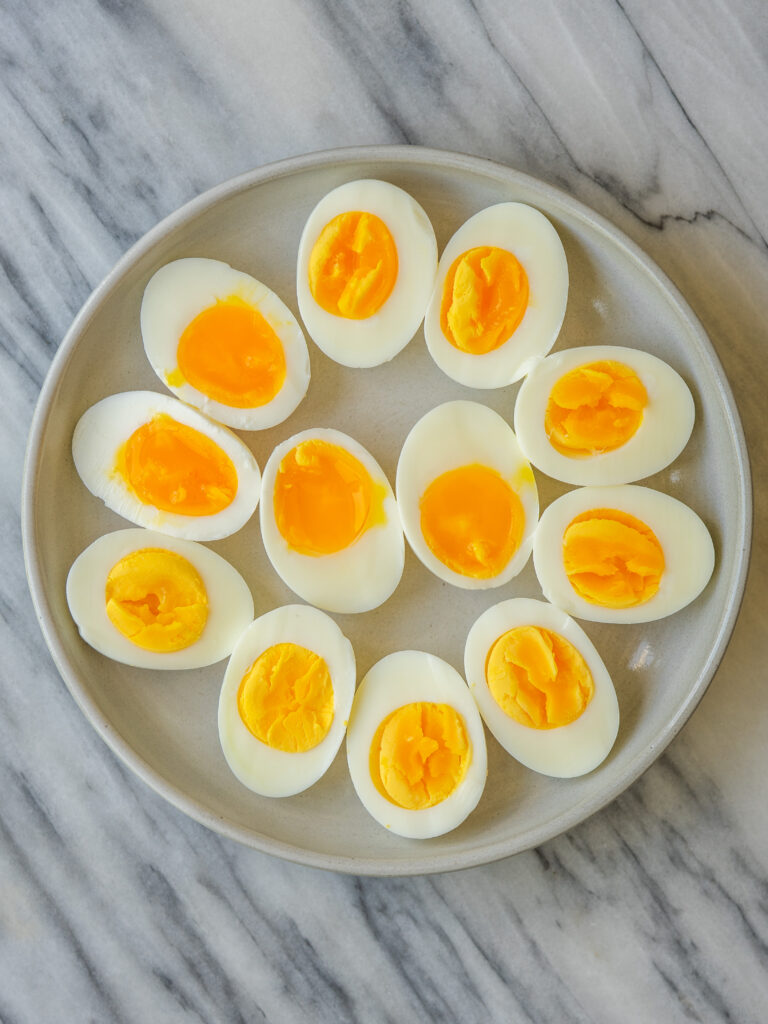 perfect boiled eggs cut in half on a plate 