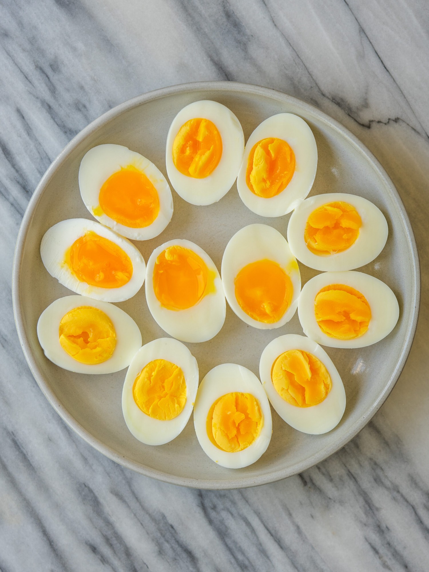 Hard boiled eggs sliced in half on a plate