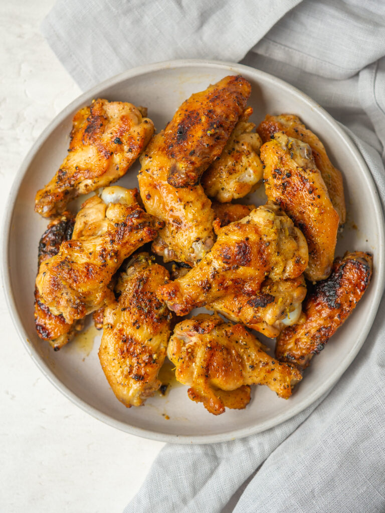 Above view of lemon pepper wings on a serving plate