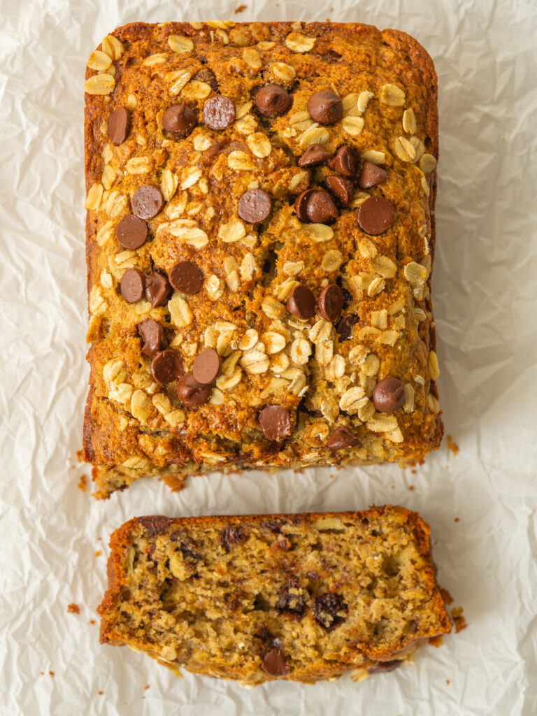 above view of oatmeal chocolate chip banana bread with one slice cut off