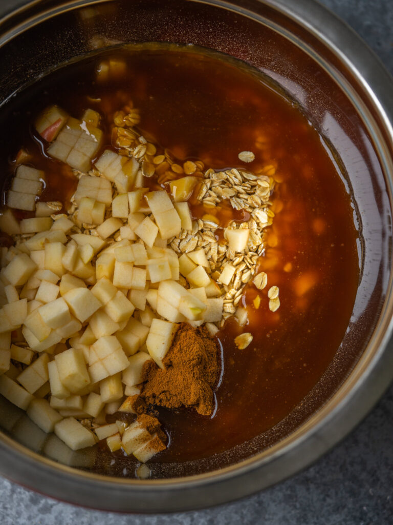 a photo of the bowl with caramel, apple, granola and cinnamon