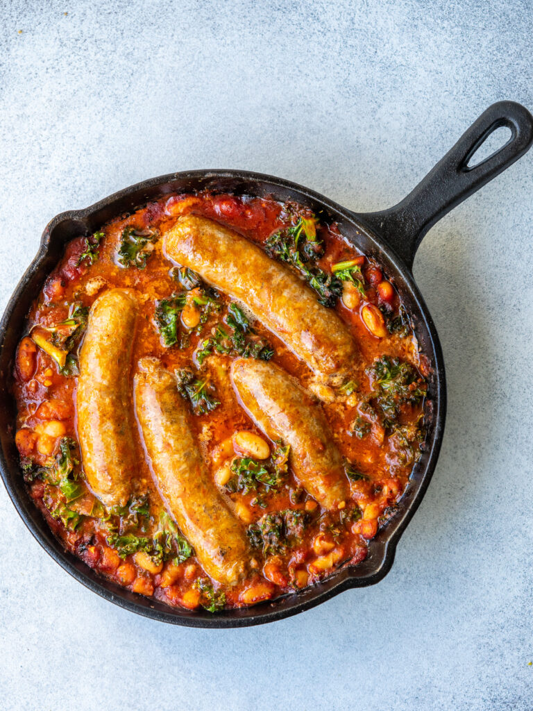 an above view image of the sausage white bean and kale skillet