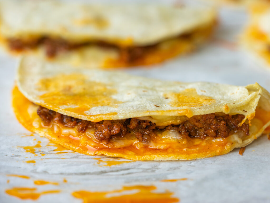 Close up view of a ground beef taco on a sheet pan