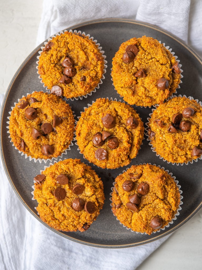 Pumpkin chocolate chip muffins on a serving plate