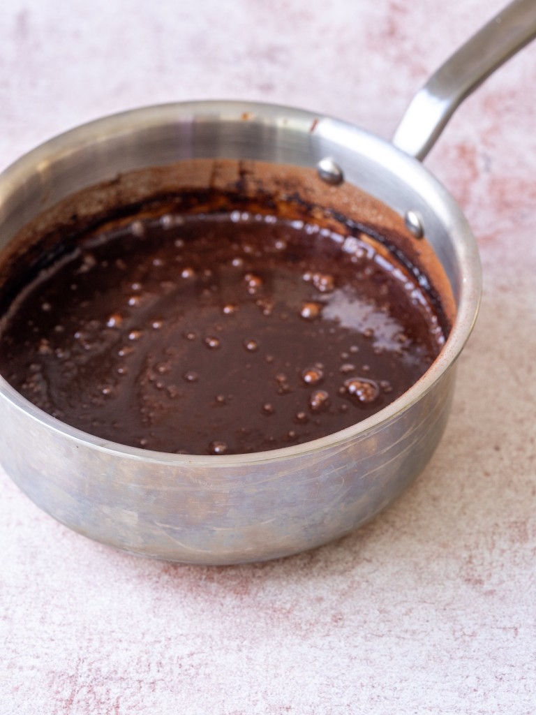 Three quarter view of mocha sauce in a sauce pan