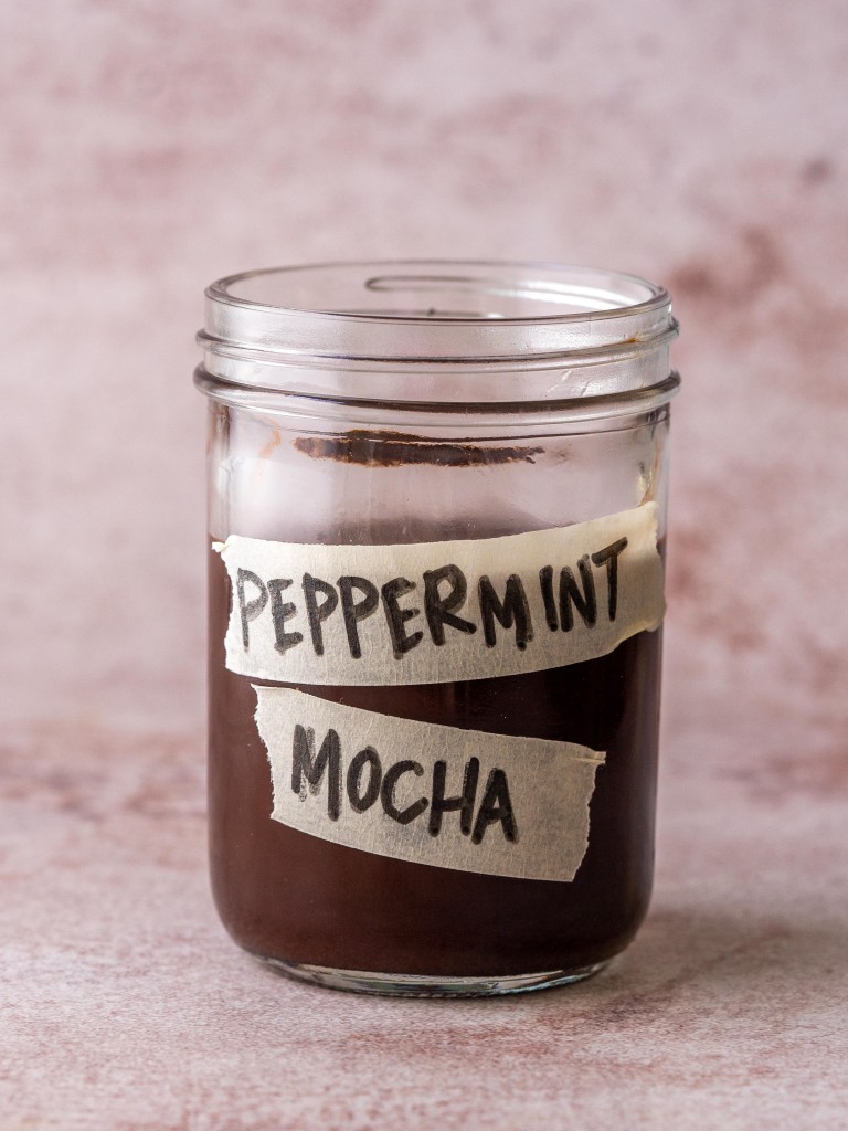 Side view of peppermint mocha syrup in a glass jar