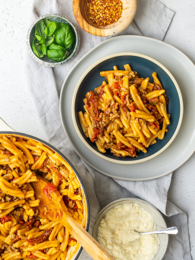Above with of a bowl of sun dried tomato and turkey one pot pasta