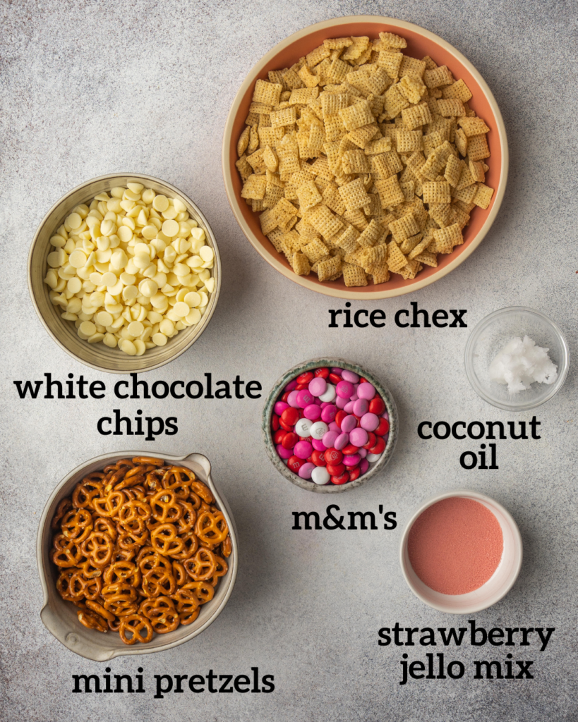 above view of ingredients for a sweet chex mix made with white chocolate and strawberry jello powder
