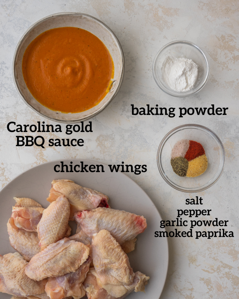 Above view of ingredients for bbq chicken wings tossed in a carolina gold bbq sauce