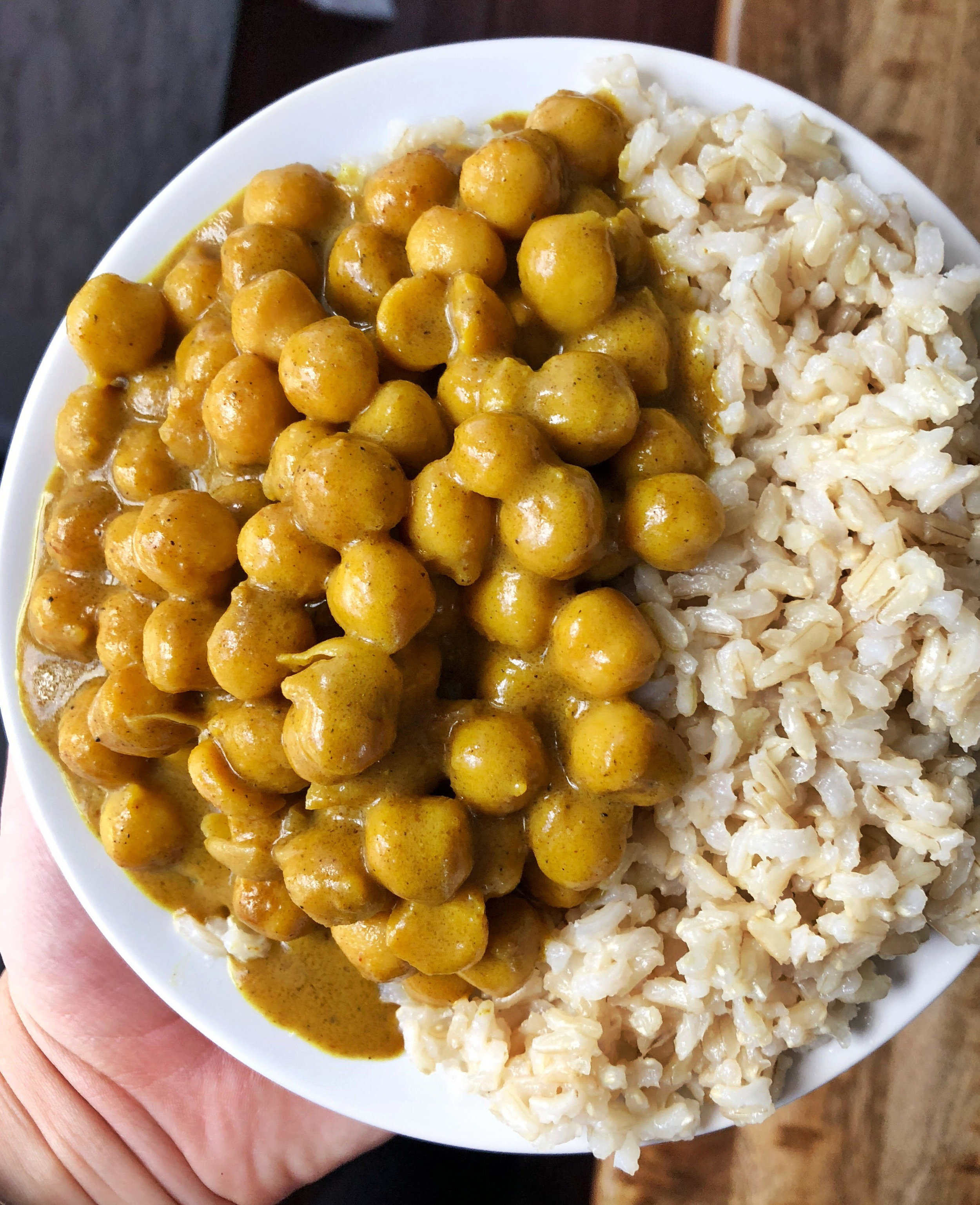 Above view of chickpea pumpkin curry in a bowl with rice