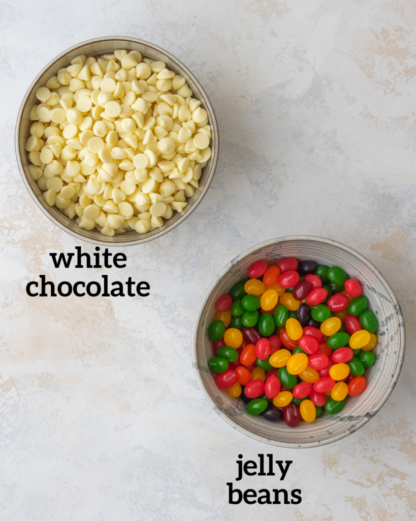 Above view of ingredients for jelly bean bark: White chocolate chips and starburst jelly beans
