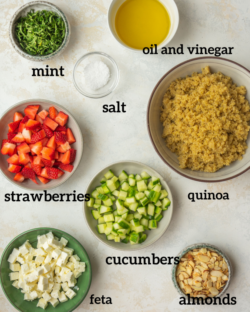 Above view of ingredients for Strawberry quinoa salad with feta