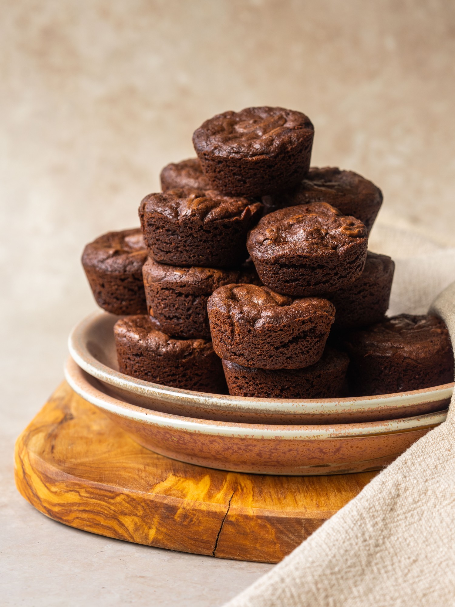Side view of fudgy brownie bites on a serving plate