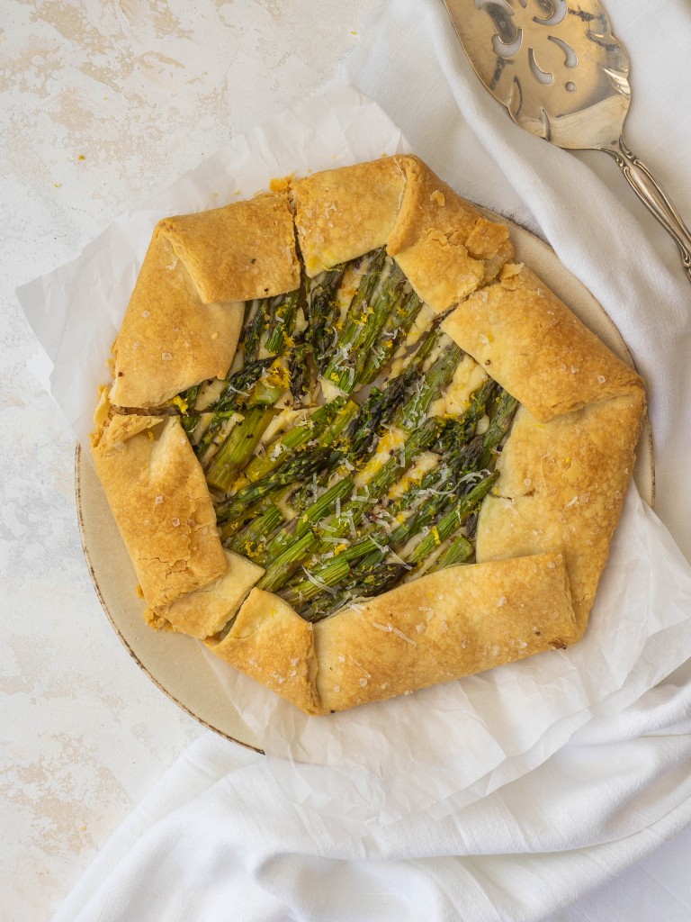 Above view of a savory vegetable galette recipe on a olate