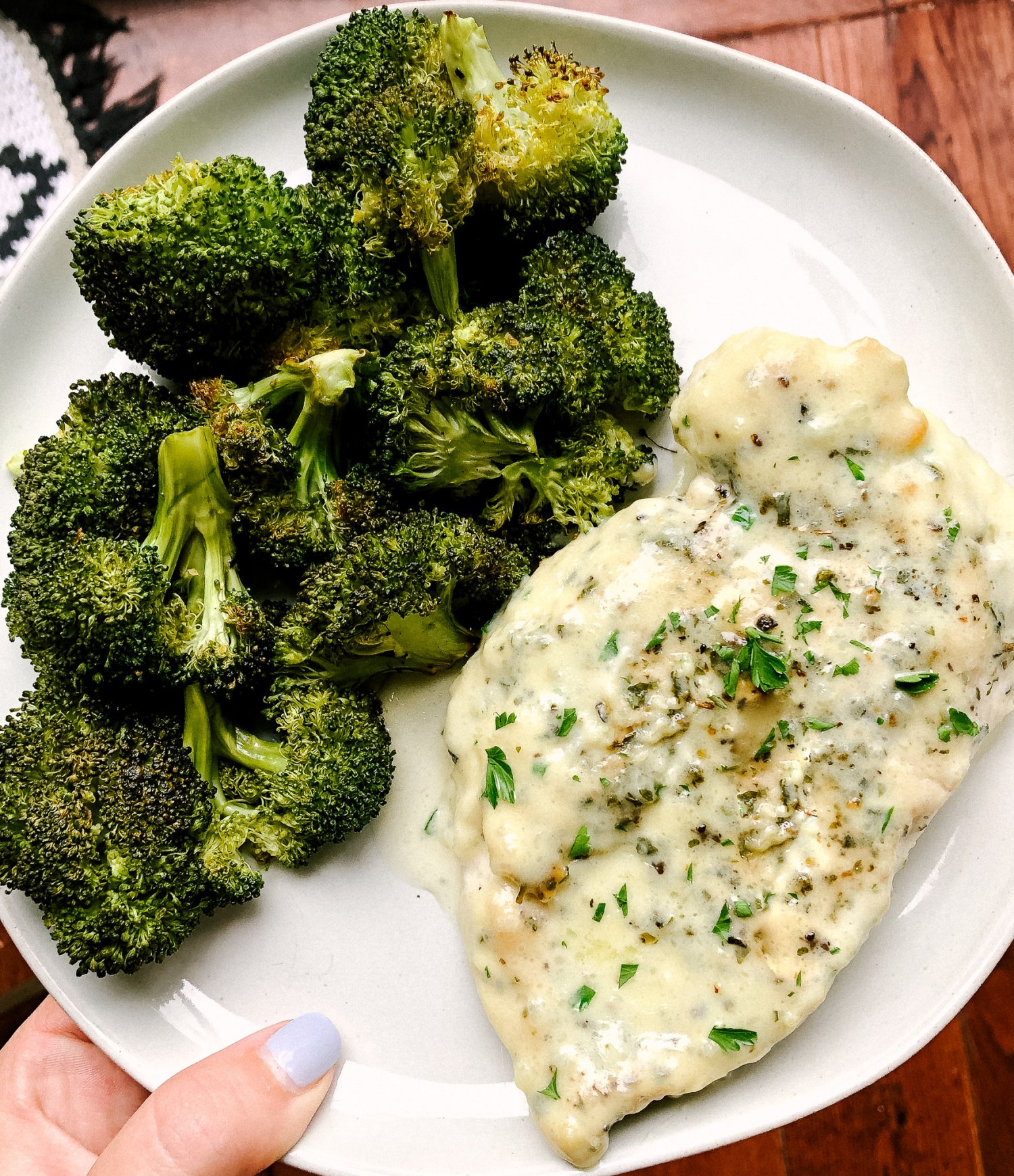 Above view of one pot chicken alfredo recipe served on  a plate with roasted broccoli