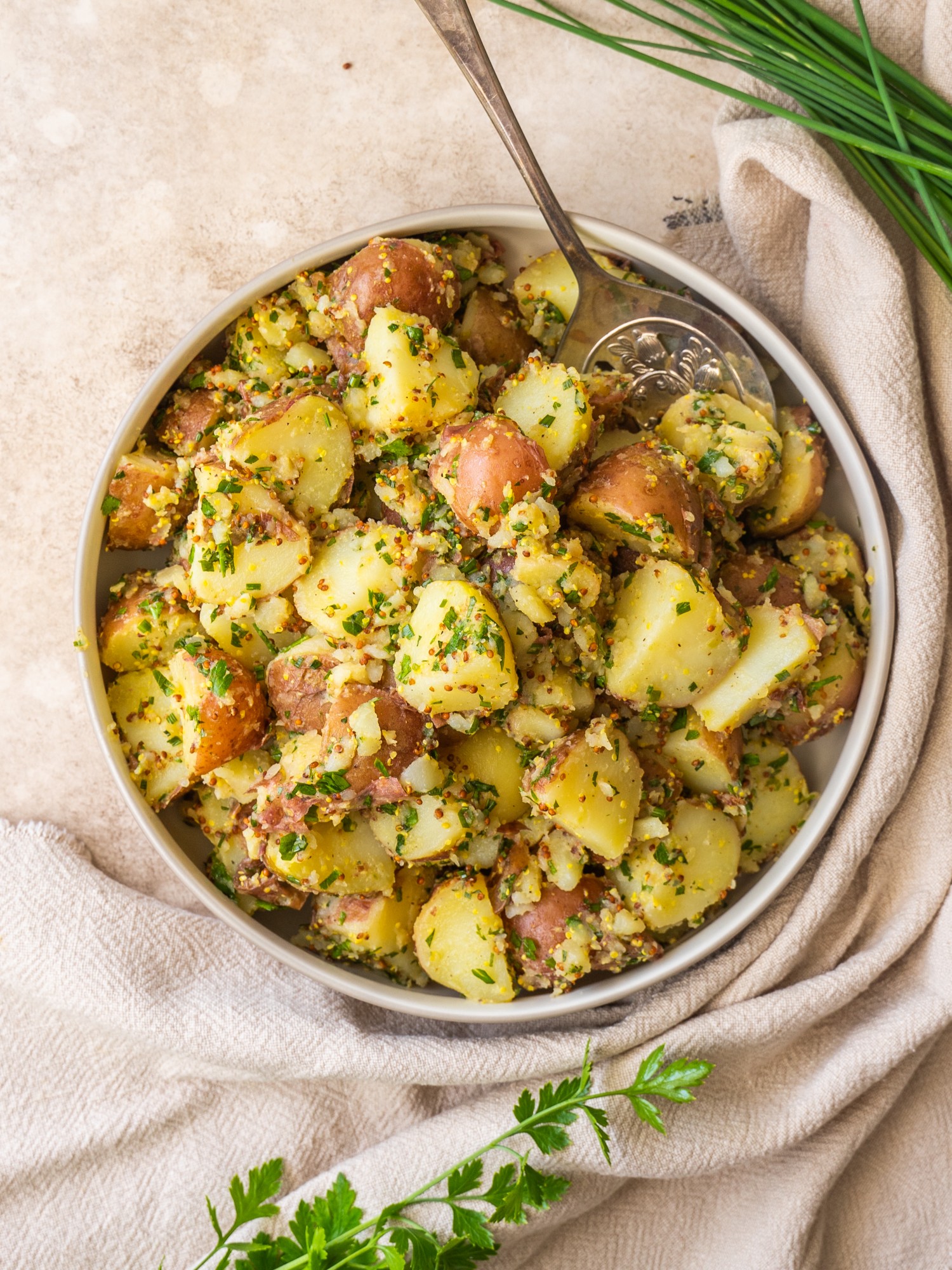 Above view of mustard potato salad in a serving bowl