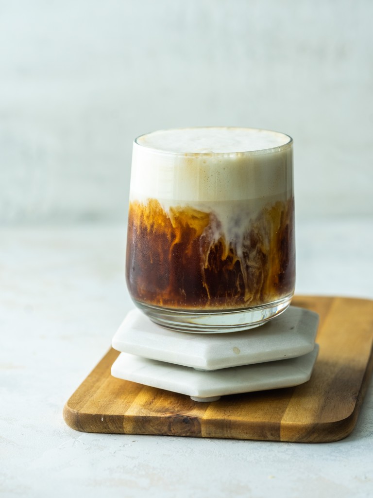 Side view of an iced brown sugar oat milk shaken espresso