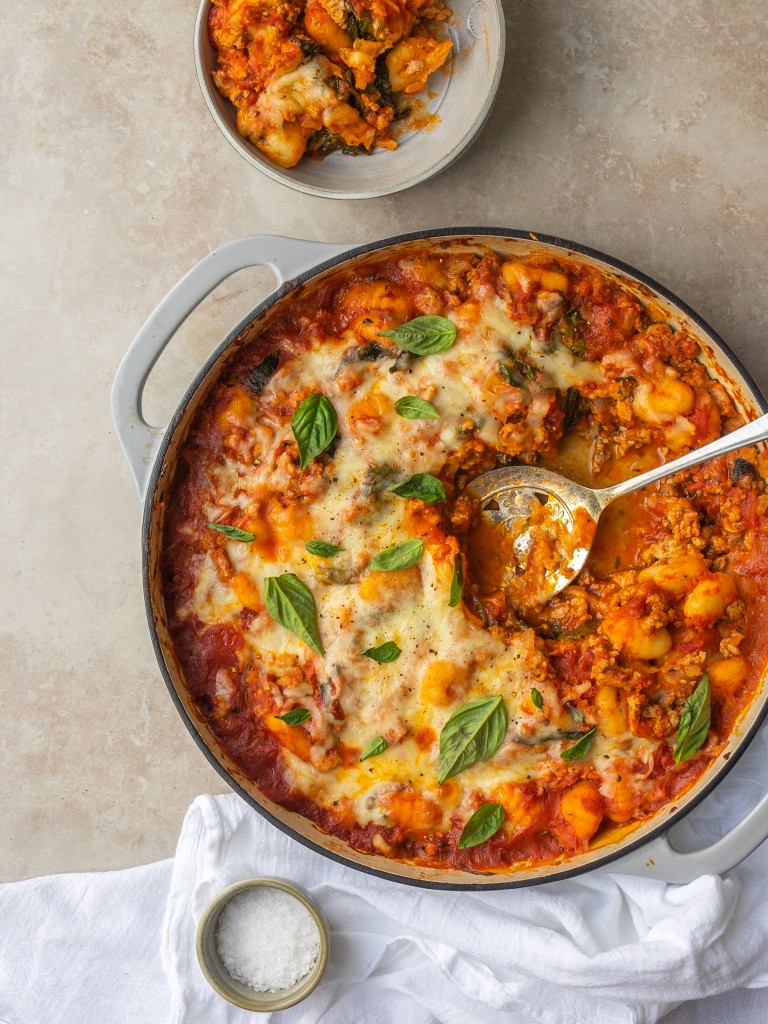 Above view fo easy baked gnocchi recipe with a serving scooped out