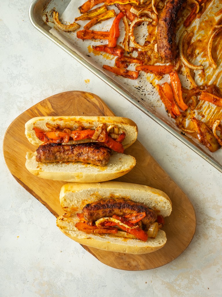 Italian sausage baked in oven on a roll