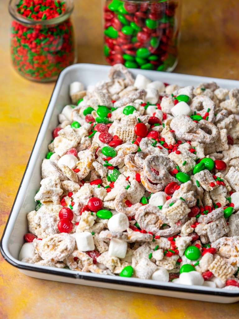 Three quarter view of christmas chex mix recipe with M&Ms