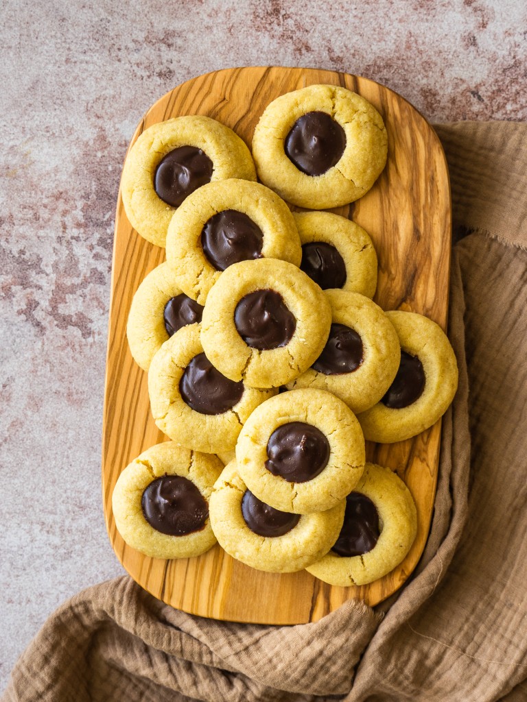Chocolate ganache cookies on a serving board