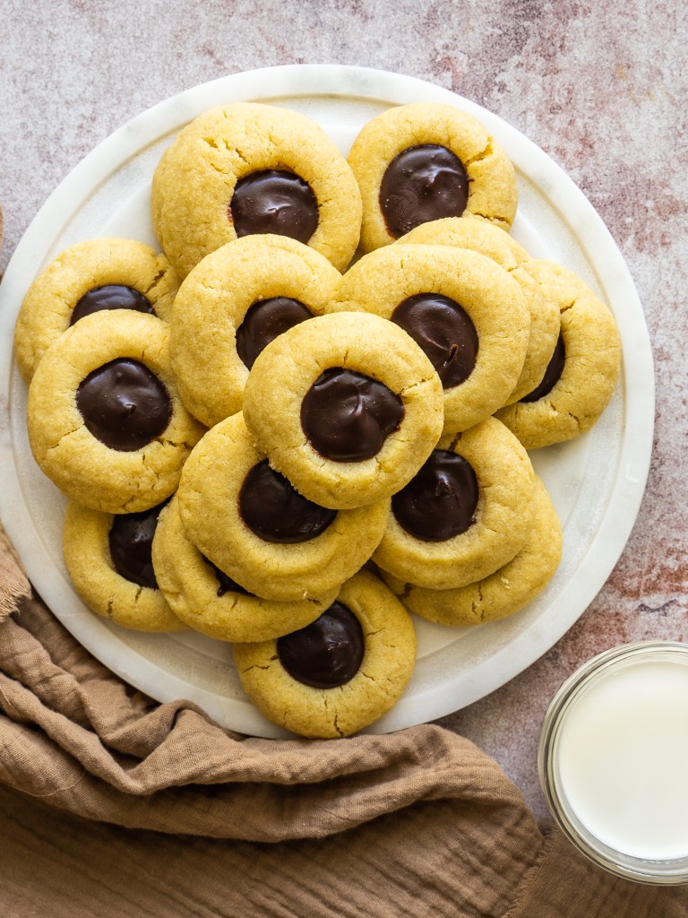 Above view of chocolate thumbprint cookies on a serving tray