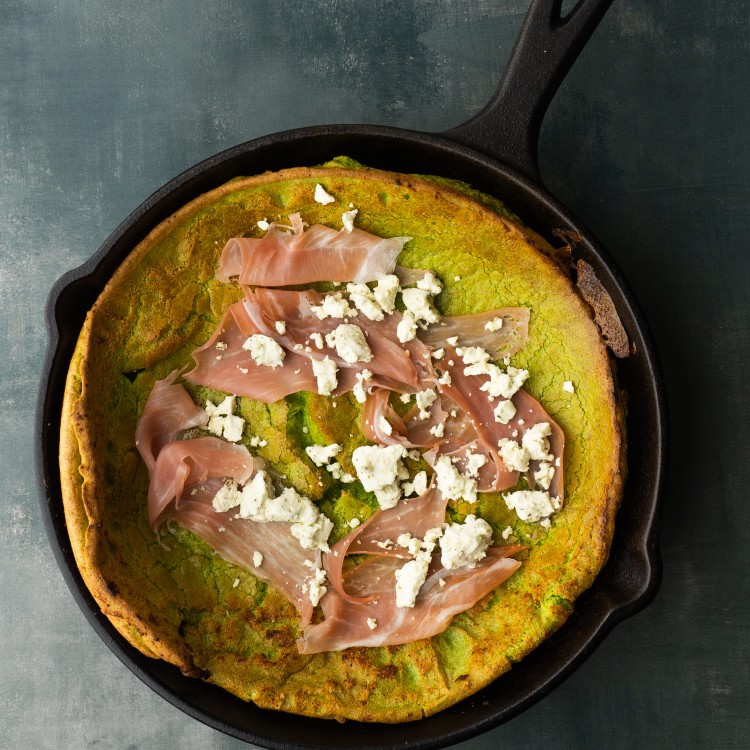 Savory dutch baby with prosciutto and goat cheese on top