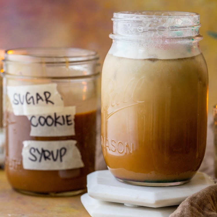 Sugar cookie syrup next to a sugar cookie latte