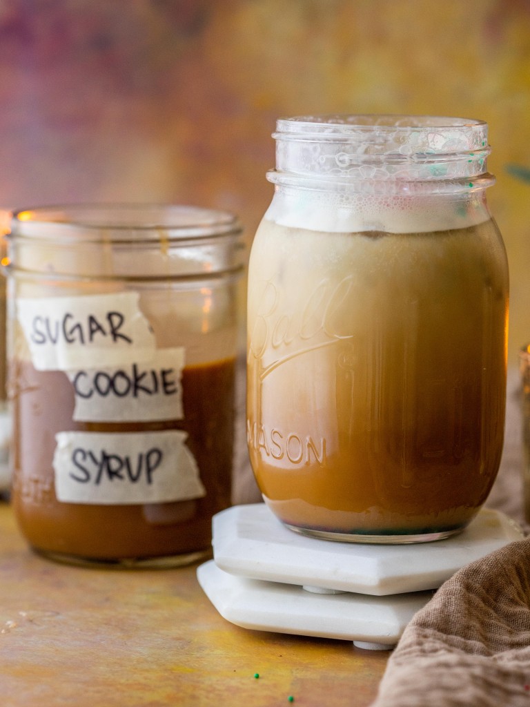 Sugar cookie syrup next to a sugar cookie latte
