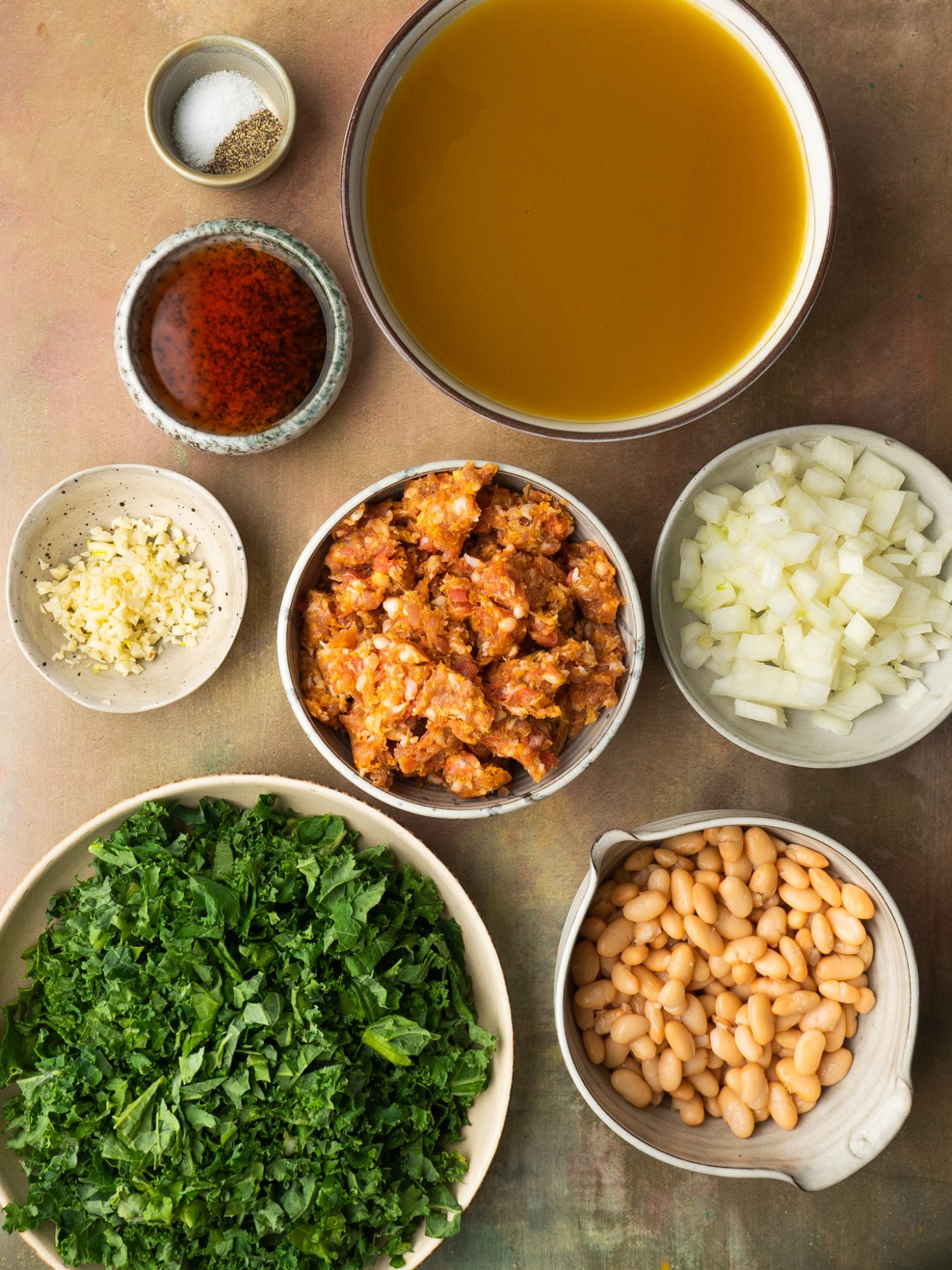 Above view of ingredients for white bean and kale soup