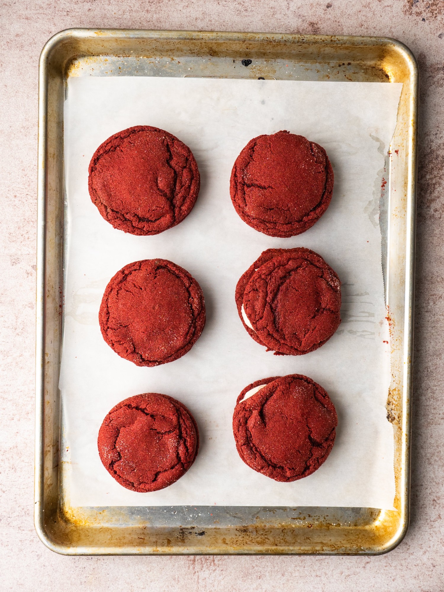 Above view of red velvet cake cookies on a baking sheet