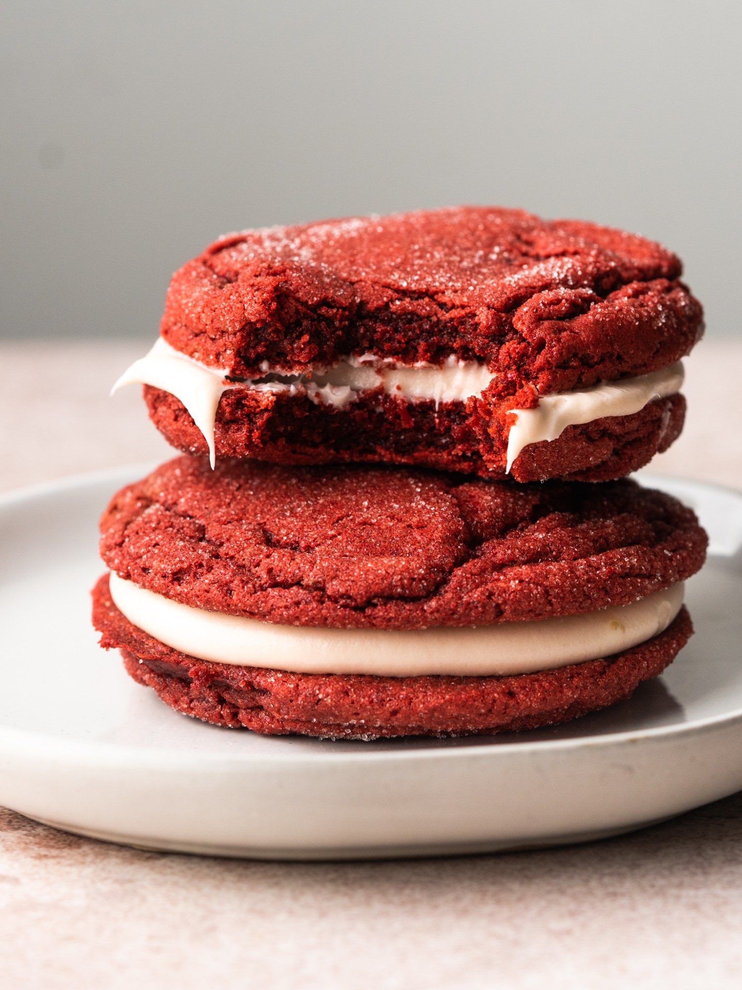 Side view of red velvet cake mix cookies on a serving plate