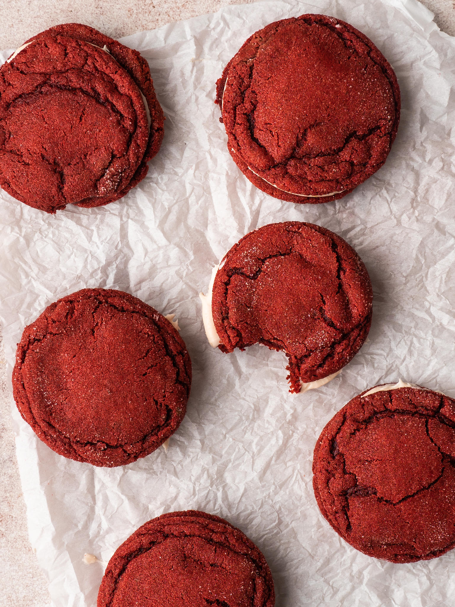 Above view of valentines day red velvet cookies on a piece of parchment paper
