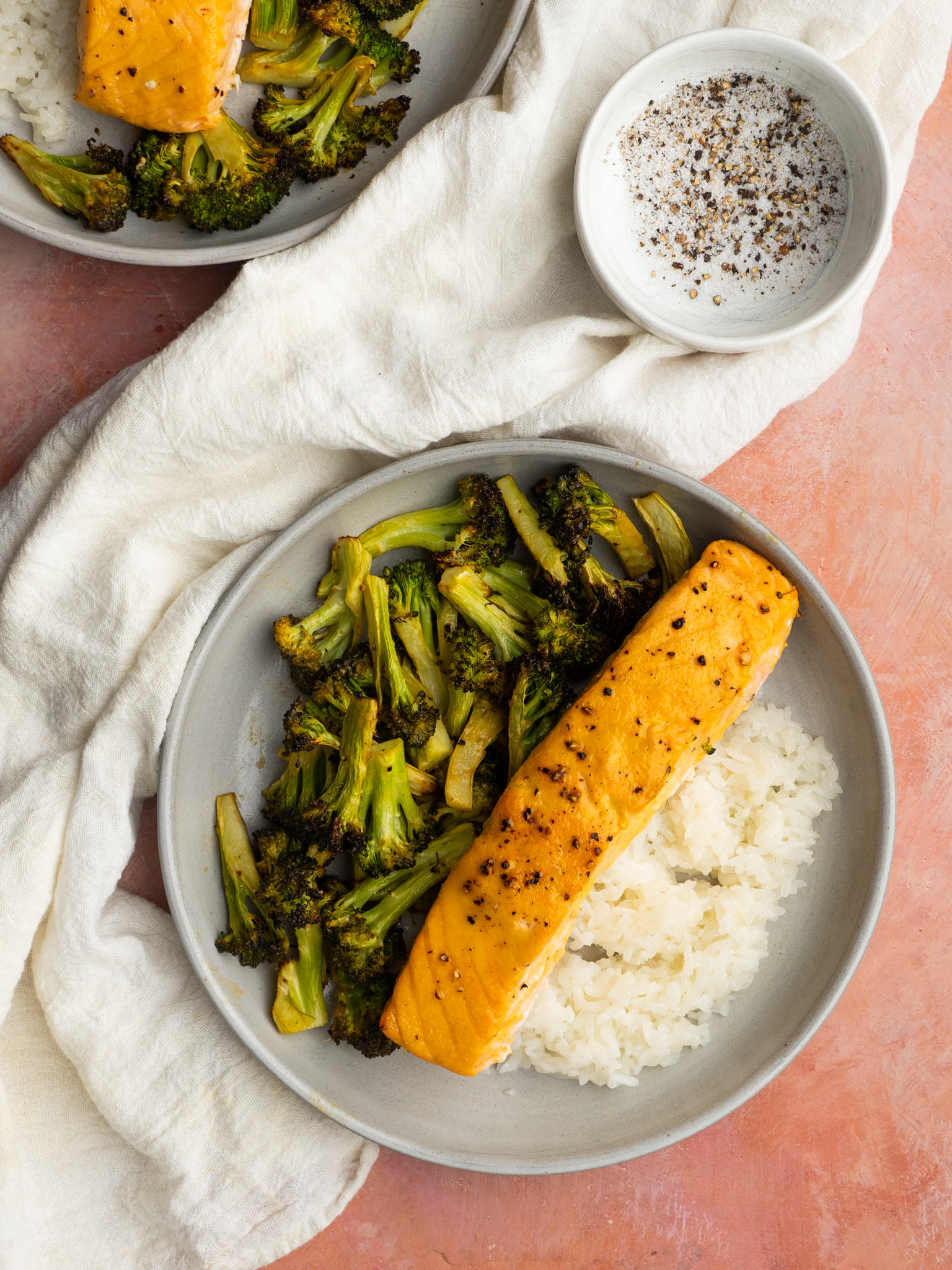 Above view of air fryer salmon and broccoli served with white rice
