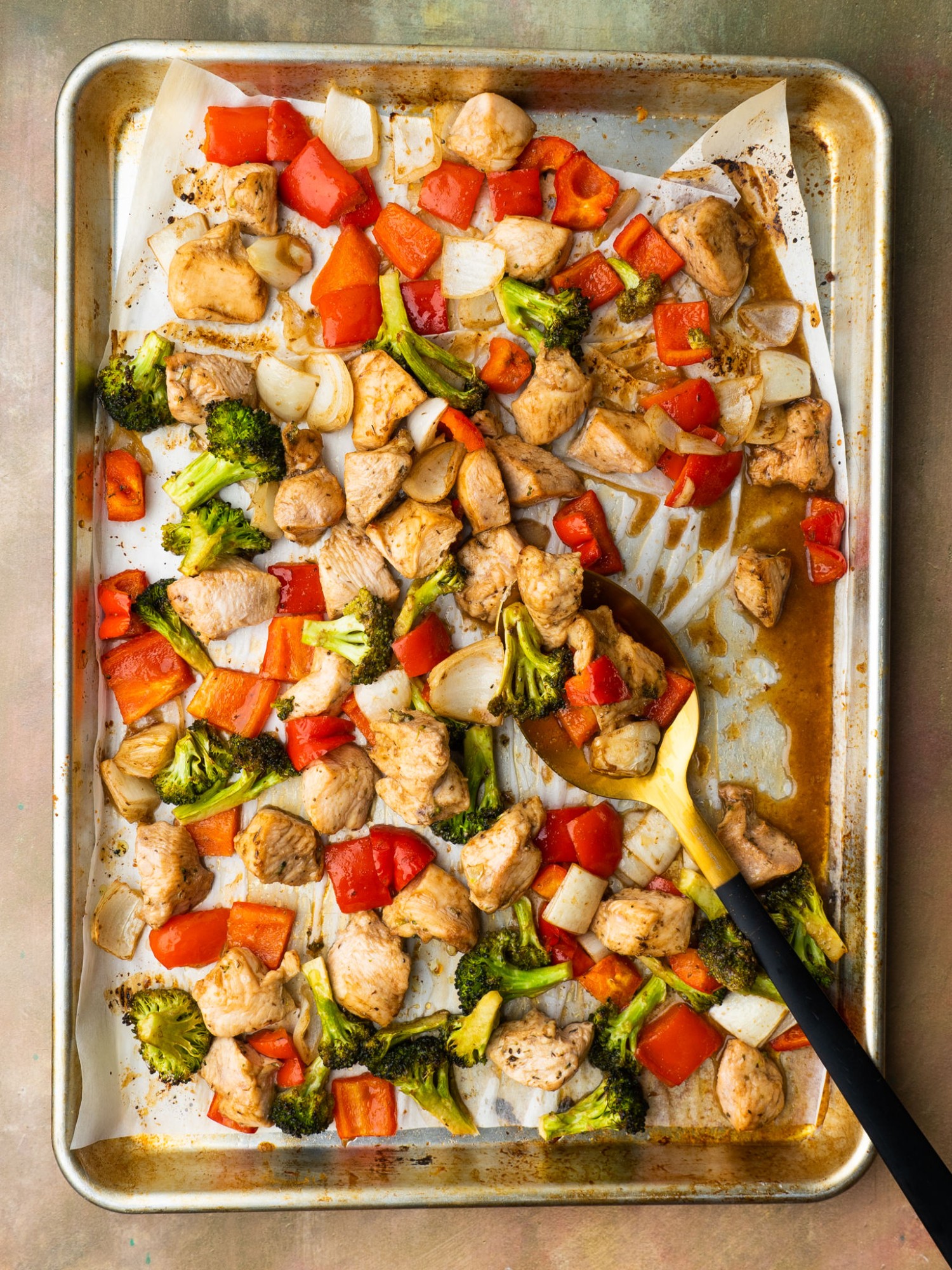 Above view of honey balsamic chicken and veggies on a sheet pan