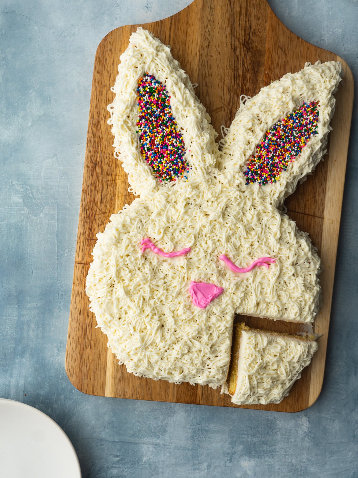 bunny cake for easter with a slice cut out