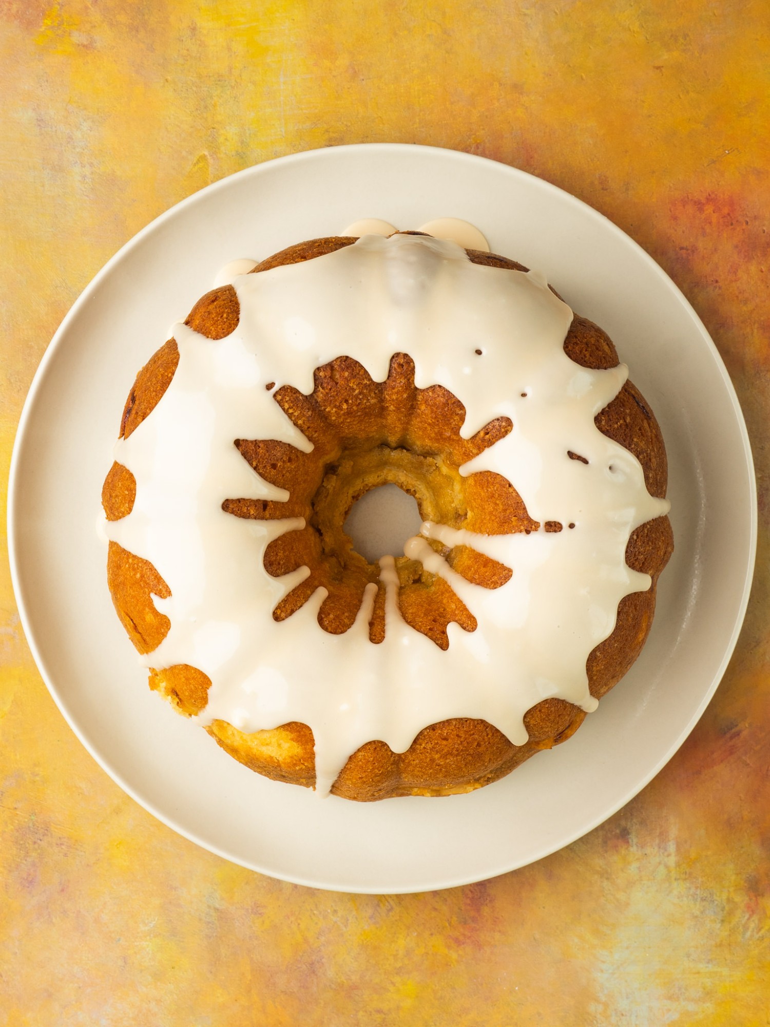 Peach cobbler pound cake topped with a glaze