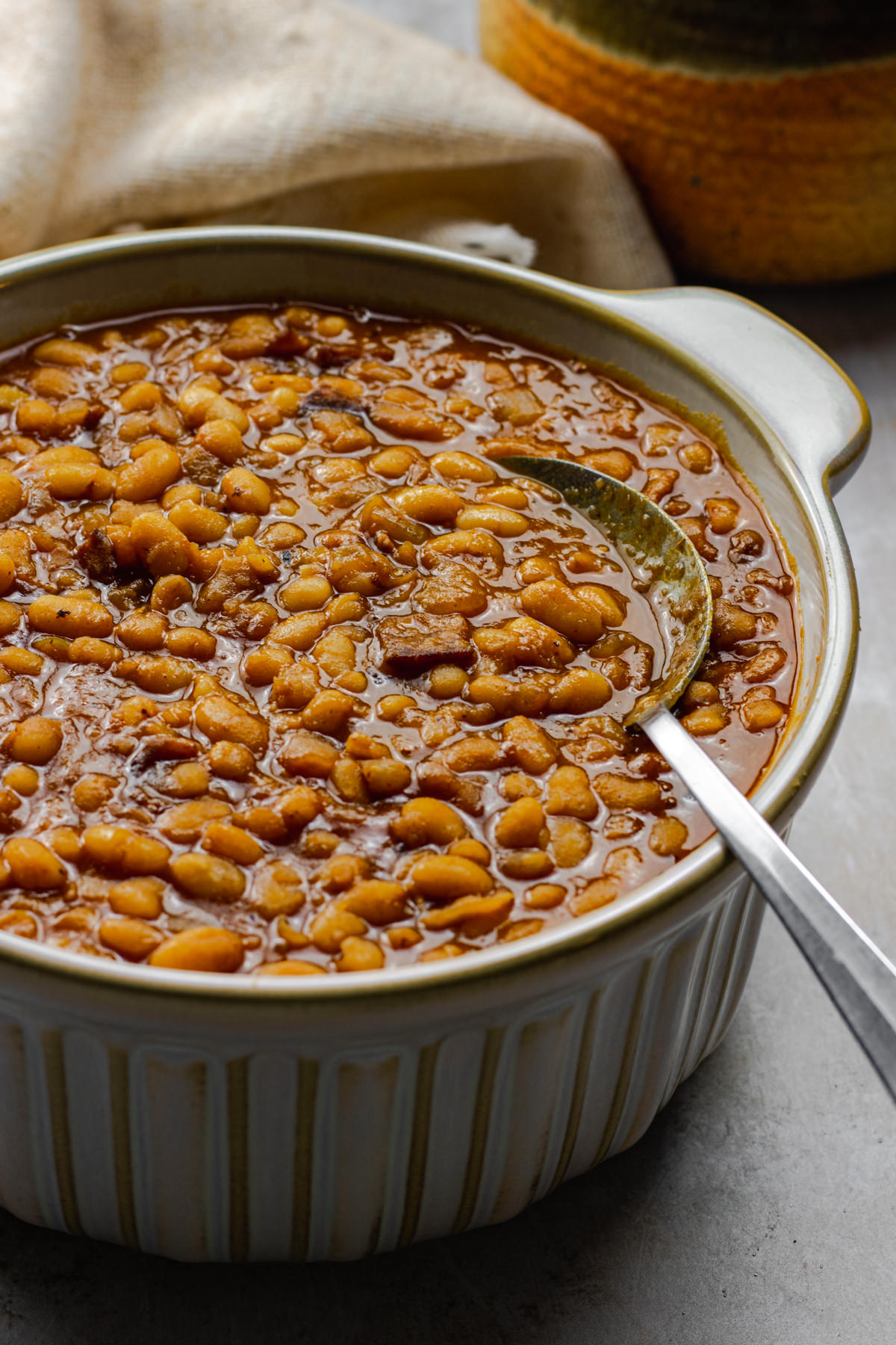 Three quarter view of baked beans recipe from scratch in a serving bowl
