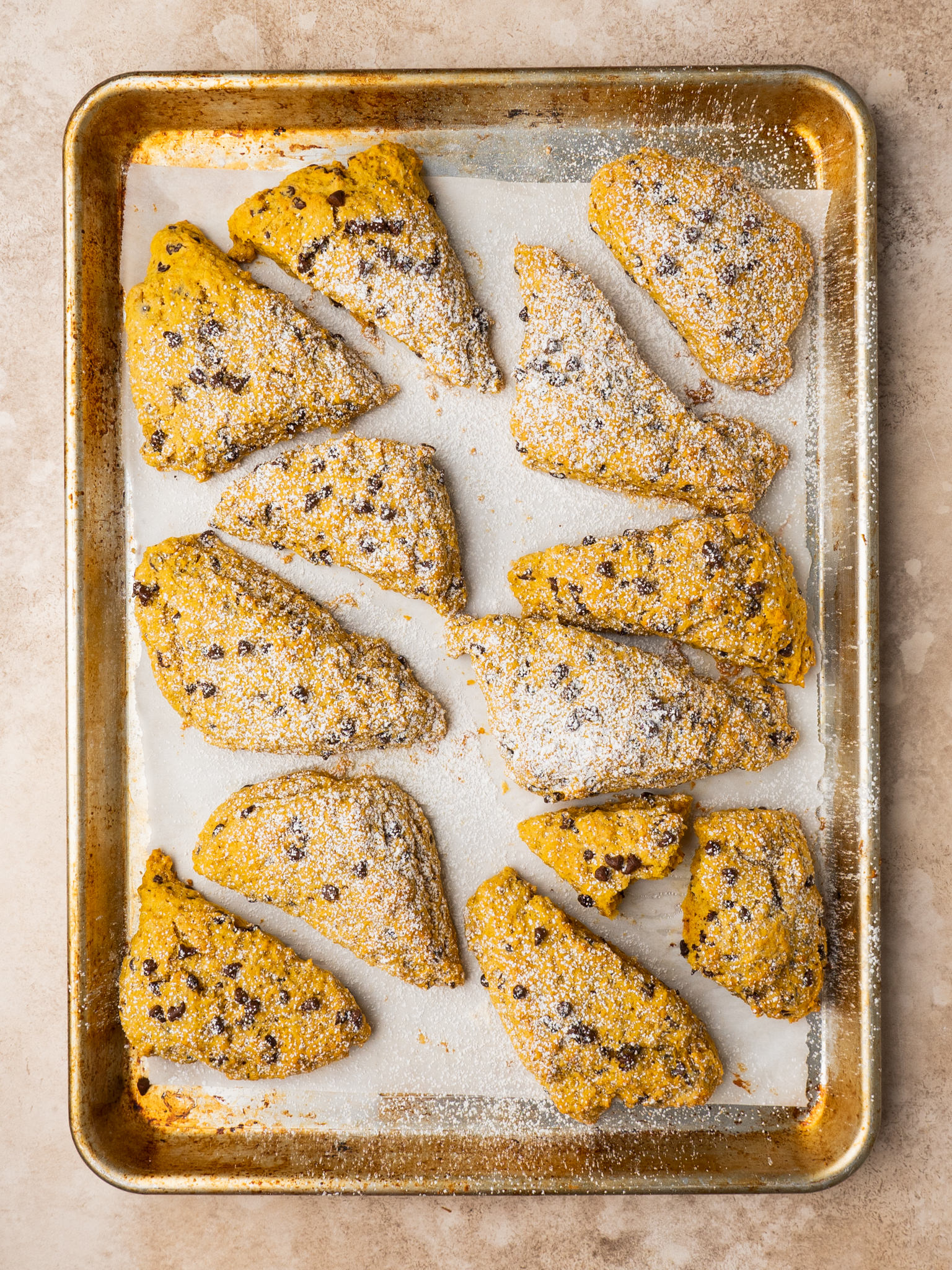 Above view of pumpkin scones on a baking sheet