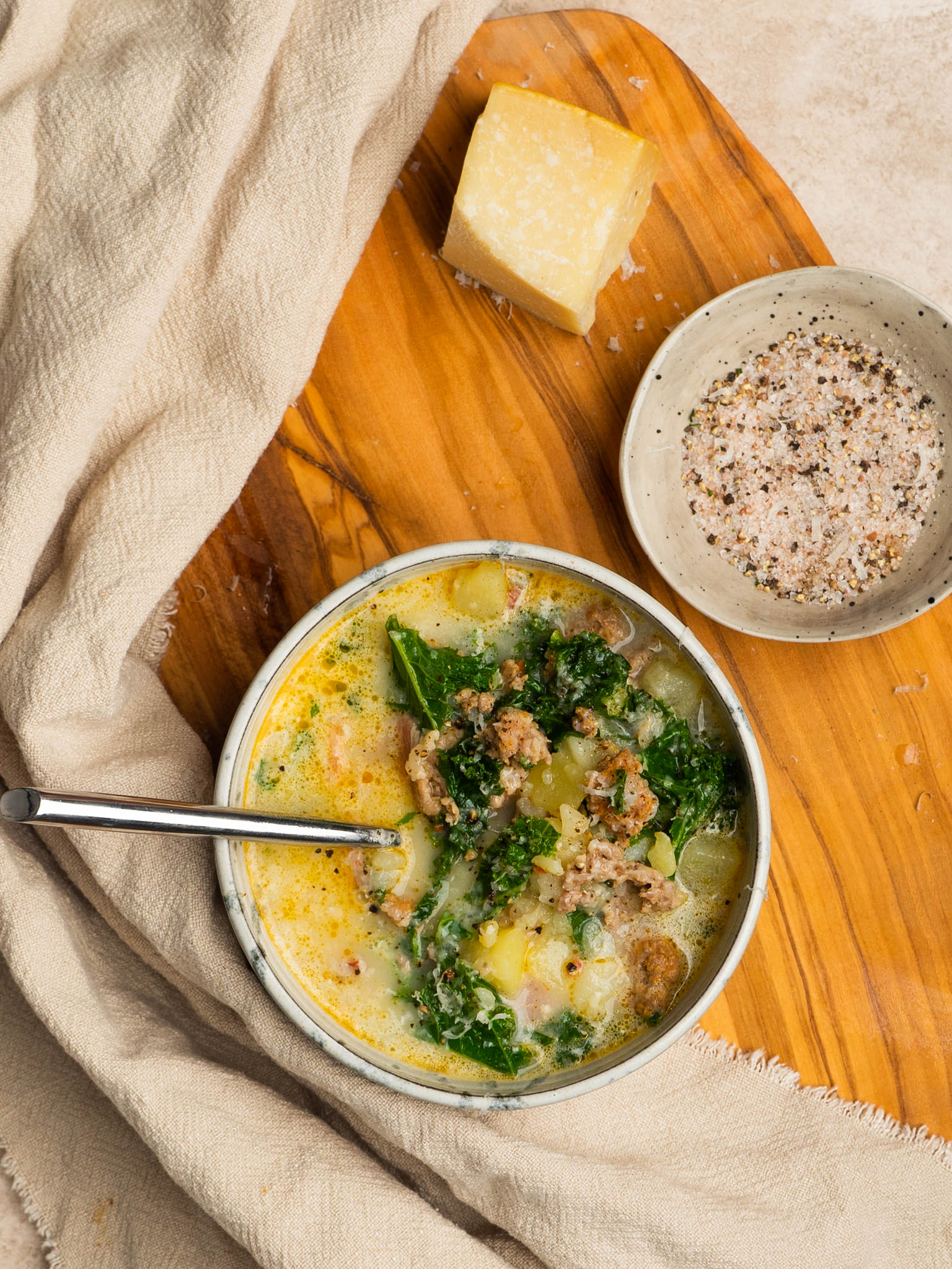 Instant pot zuppa toscana served with extra parmesan cheese