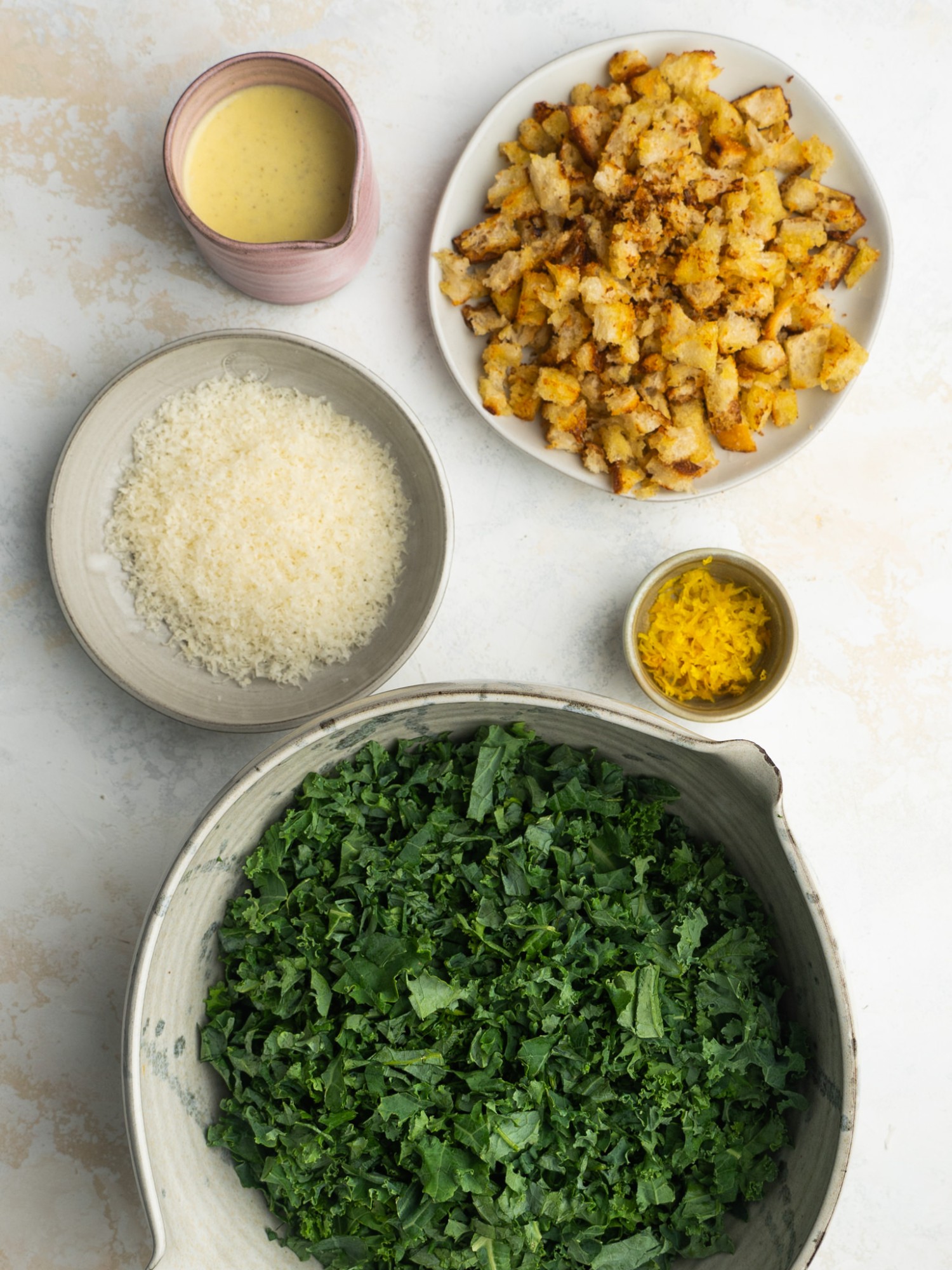 Above view of ingredients for a kale caesar salad recipe